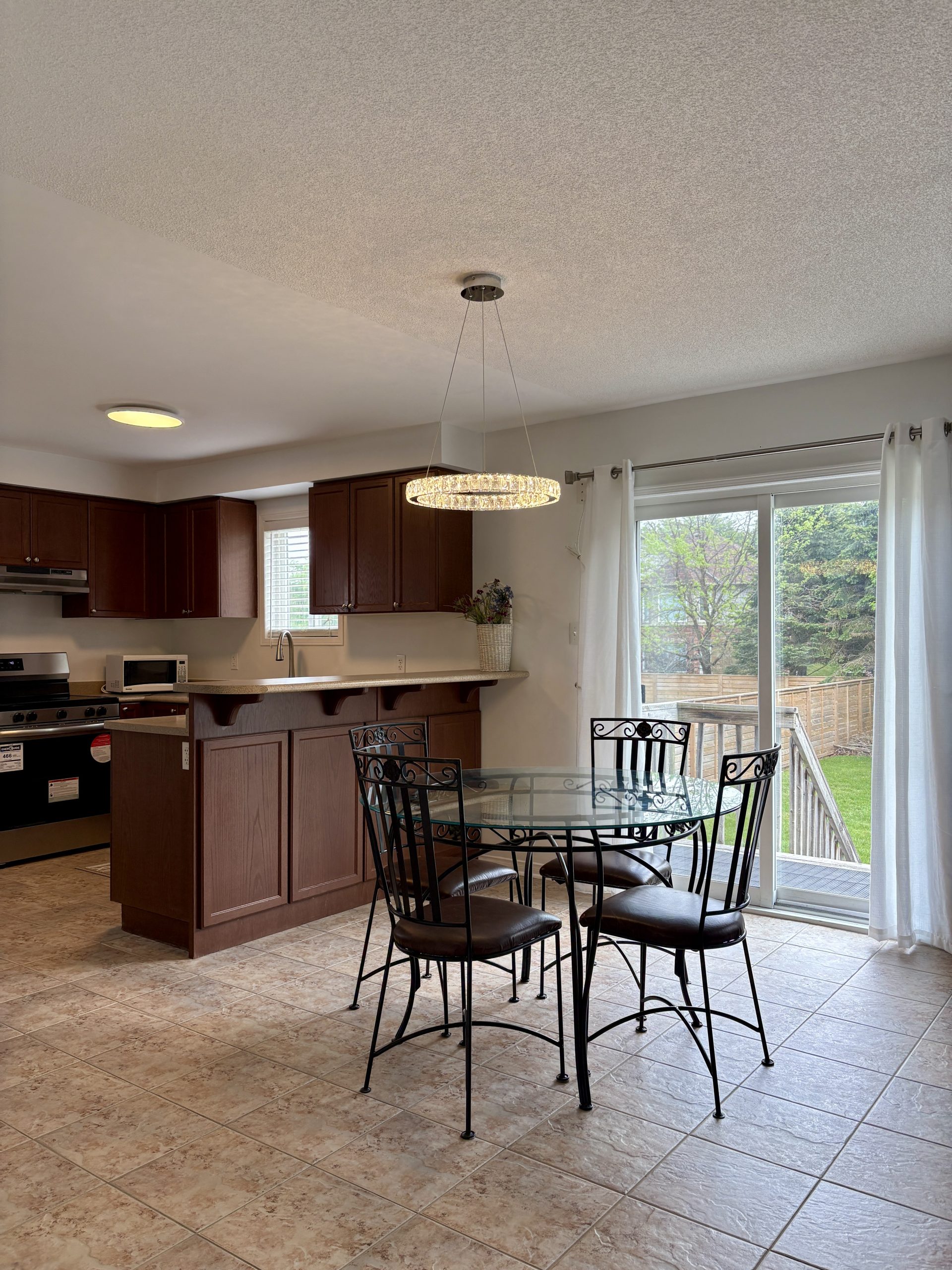 Upper-floor dining area and kitchen at 55 Regina Boulevard, Wasaga Beach